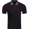 Vassari branded fashion polo in black with a teal and red colored collar.